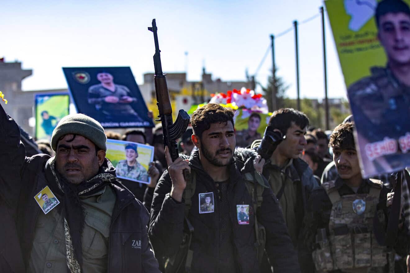 Comrades attend the funeral of five fighters of the Kurdish-led Syrian Democratic Forces (SDF) who were killed in Manbij during clashes with Turkish-backed opposition factions earlier this week, in Qamishli in northeastern Syria on Dec. 14, 2024. Photo by Delil souleiman/AFP via Getty Images.