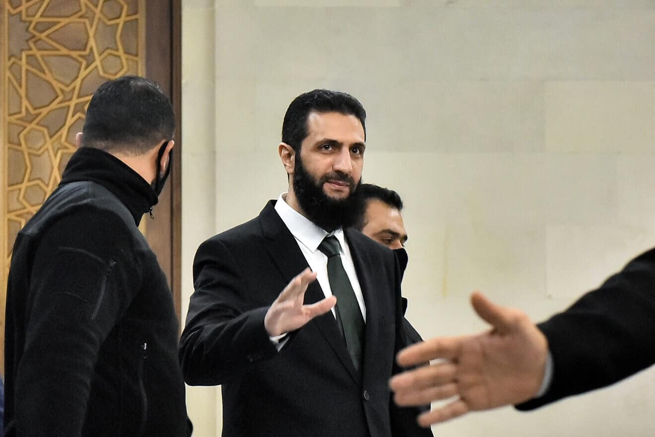 Hayat Tahrir al-Sham (HTS) leader Ahmed al-Sharaa (also known as Abu Mohammad al-Julani) arrives for a meeing with visiting Druze officials from Lebanon's Progressive Socialist Party (PSP) in Damascus on Dec. 22, 2024. Photo by AFP via Getty Images.