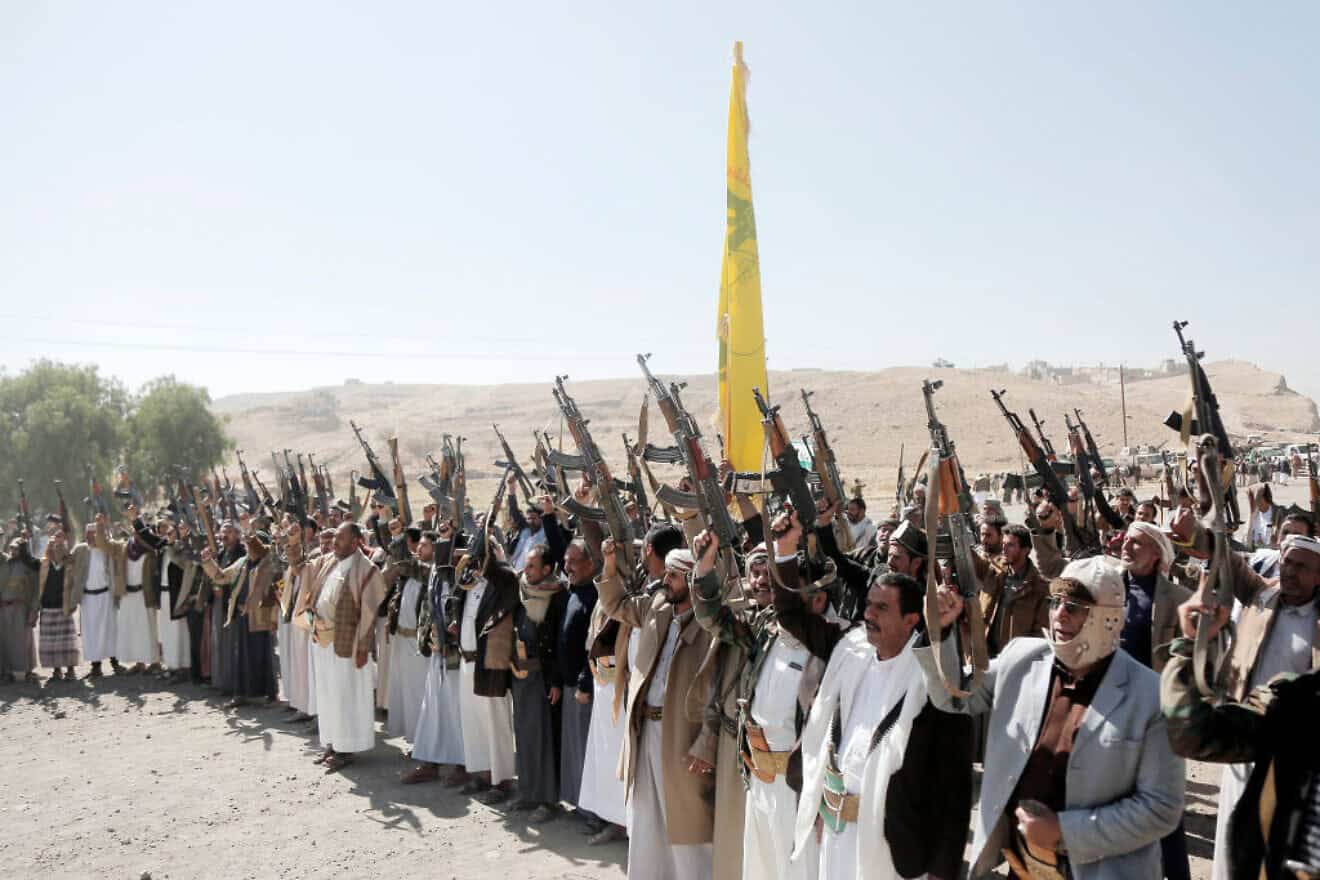 Houthi followers chant slogans as they participate in a tribal rally on the outskirts of Sanaa against Israeli and U.S. air attacks on Yemen, on Dec. 17, 2024. Photo by Mohammed Hamoud/Getty Images.