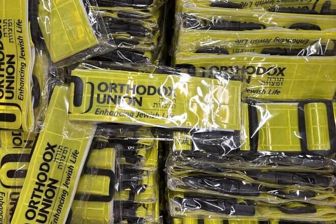 Reflective yellow belts distributed by the Orthodox Union to protect individuals walking home from synagogue in the dark. Credit: Courtesy.