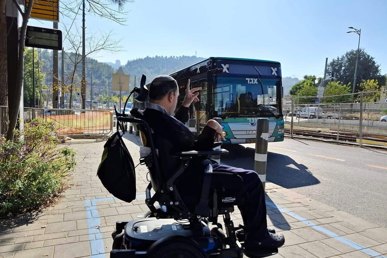 A man in a wheelchair works to bring awareness in Israel about issues of public transportation as part of International Day of Persons with Disabilities on Dec. 3, 2024. Credit: Israel Elwyn.