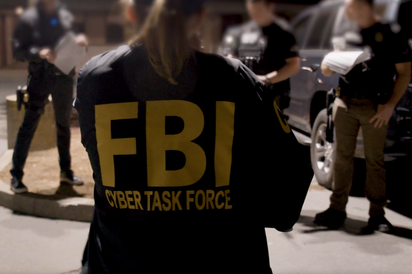 A member of an FBI Cyber Task Force joins her law enforcement colleagues in preparing for a Joint Criminal Opioid and Darknet Enforcement team operation in 2021. Credit: FBI.