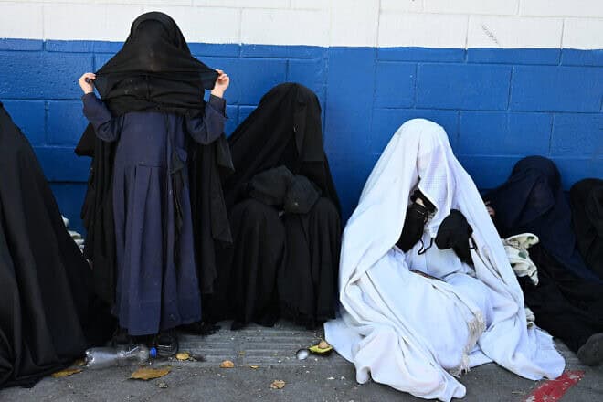 Women from the Lev Tahor Jewish community remain outside the Alida Espana de Arana special education school where rescued cult children were in Guatemala City, on Dec. 22, 2024. Photo by Johan Ordóñez/AFP via Getty Images.