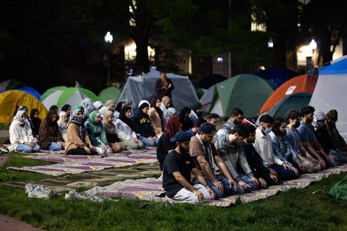 Students pray at the Gaza solidarity encampment at George Washington University, in its 12th day, Washington, D.C., on May 6, 2024. Photo by Allison Bailey/Middle East Images/AFP via Getty Images.