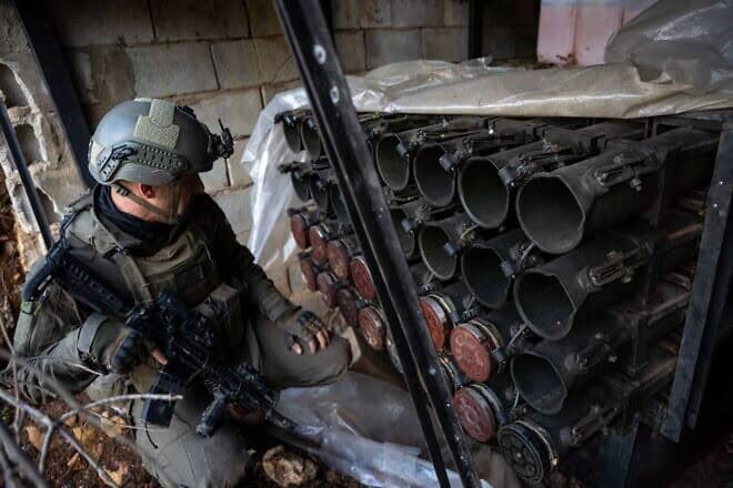 An Israeli soldier examines anti-tank ordnance seized from Hamas's Radwan Force in Southern Lebanon, Dec. 28, 2024. Credit: IDF.