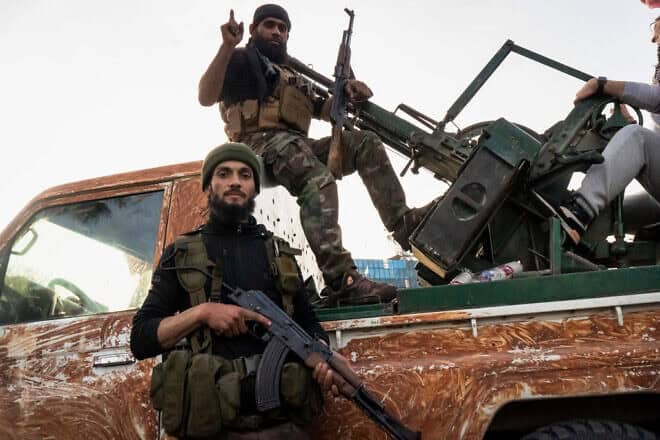 Rebel fighters at Umayyad Square in Damascus as people gather to celebrate the end of Assad family rule, Dec. 10 2024. Photo by Nael Chahine/Middle East Images/AFP via Getty Images.