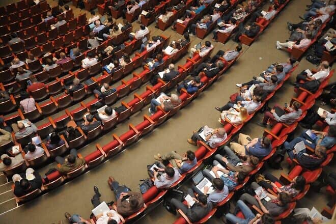 An audience in an event space. Credit: crystal710/Pixabay.