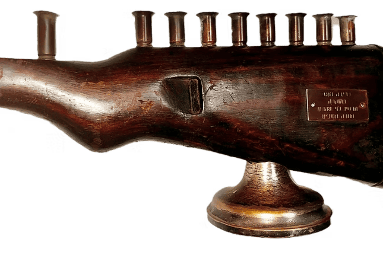A Chanukah menorah from an Israel Defense Forces Soldier built from a World War II German Mauser rifle is one of the items up for auction to benefit Beit Udi. Credit: Courtesy.