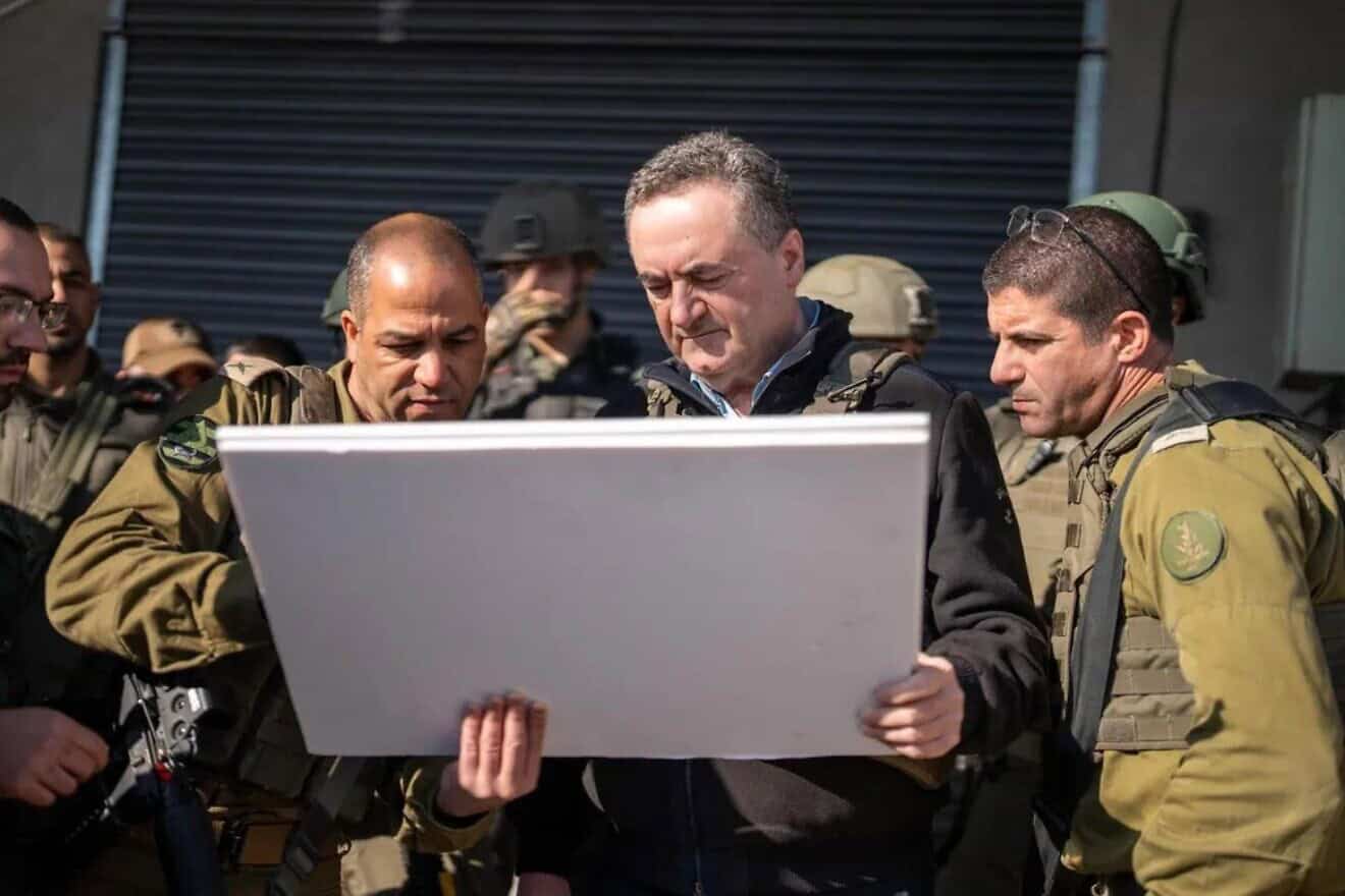 Israeli Defense Minister Israel Katz with IDF officers during a visit to the scene of Monday's deadly terrorist shooting attack in Samaria, Jan. 7, 2024. Credit: Ariel Hermoni/ Ministry of Defense.