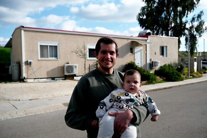 Alon Israel and his son, Mevaser Yitzhak, near their home in Trump Heights in northern Israel, on Jan. 20, 2025. Photo by Canaan Lidor.