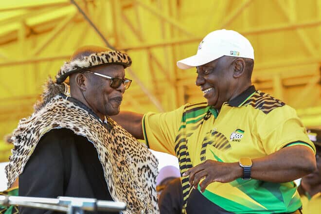 South African and African National Congress President  Cyril Ramaphosa (right) presents an honorary leopard skin to veteran ANC member Benson Fihla during the party's 113th anniversary celebrations at a large open field in the Khayelitsha area of Cape Town on Jan. 11, 2025. Photo by Rodger Bosch/AFP via Getty Images.