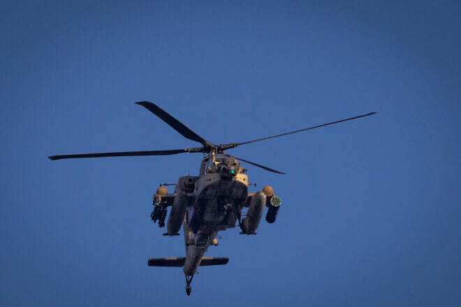 An Israeli military helicopter fly above Kiryat Yam, near Haifa, Nov. 13, 2024. Photo by Yonatan Sindel/Flash90.