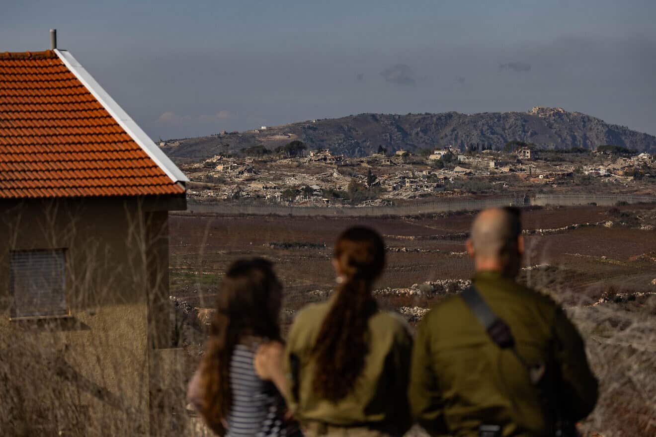 Israelis in Metula view damage from an IDF operation across the border in Lebanon, Dec. 9, 2024. Photo by Chaim Goldberg/Flash90.