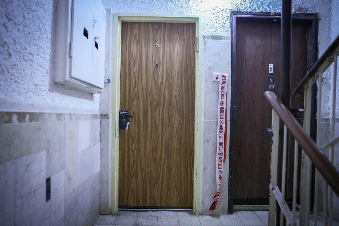 Police tape outside an apartment in central Jerusalem where an elderly woman was found wounded, on Dec. 19, 2024. Photo by Chaim Goldberg/Flash90.