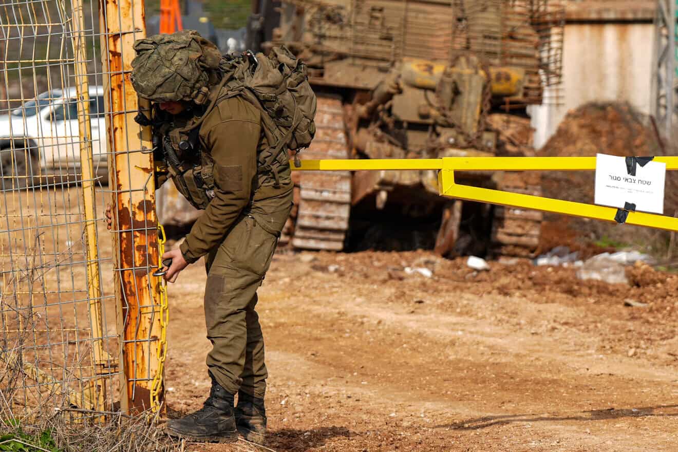 An Israeli soldier closing a gate on the Israeli border with Lebanon on Jan. 12, 2025. Photo by Ayal Margolin/Flash90.