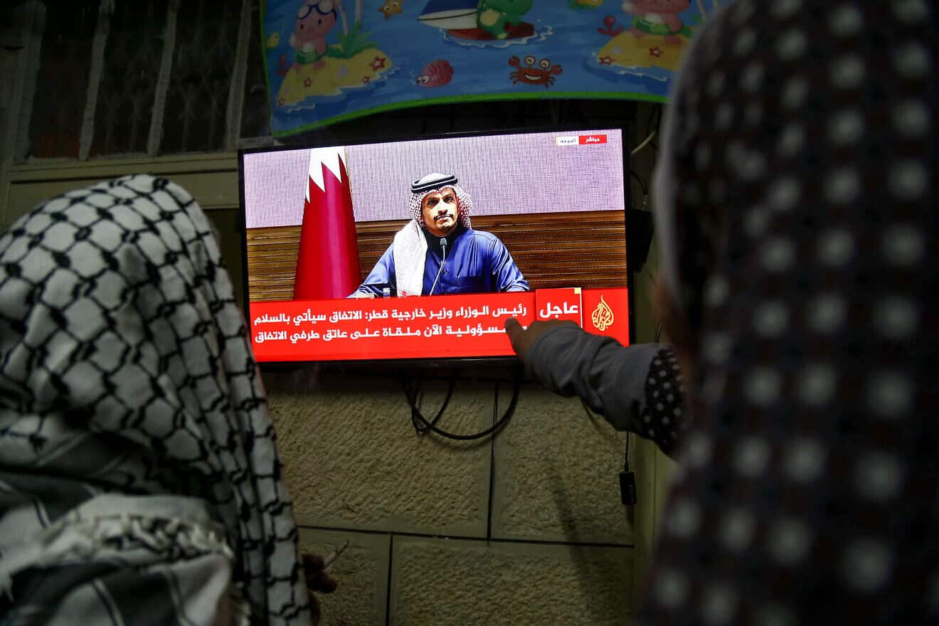Palestinians in Hebron watch a press conference of Qatar’s Prime Minister Sheikh Mohammed bin Abdulrahman Al Thani on the ceasefire deal between Israel and Hamas, on Jan. 15, 2025. Photo by Wisam Hashlamoun/Flash90.