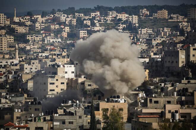 Smoke rises during an Israeli military operation, in the Samaria city of Jenin, Jan. 24, 2025. Photo by Nasser Ishtayeh/Flash90.