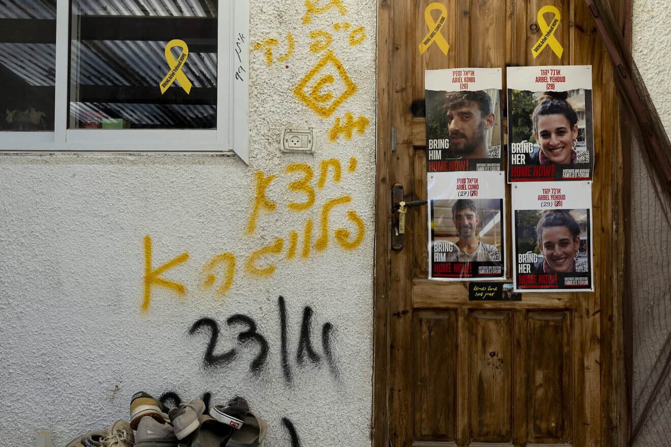 Photos hang at the entrance to the house of couple Arbel Yehud and Ariel Konio, who were kidnapped during the deadly Oct 7, 2023 Hamas-led attack and are held hostage in the Gaza Strip, Kibbutz Nir Oz, Israel, Dec. 5, 2024. Photo by Amir Levy/Getty Images.