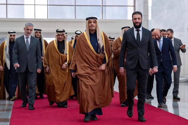 Qatari Prime Minister Sheikh Mohammed bin Abdulrahman Al Thani (center) and Syrian leader Ahmed al-Sharaa (right) in Damascus, on Jan. 16, 2024. Credit: Qatari Ministry of Foreign Affairs.
