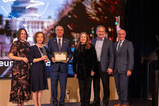 Ambassador Herzog holding a copy of the oldest Hebrew book in the world together with his wife Shirin, Steve and Jackie Green, Rivka Kidron, and CEO of Museum of the Bible Dr. Carlos Campo. Credit: Cade Chudy.