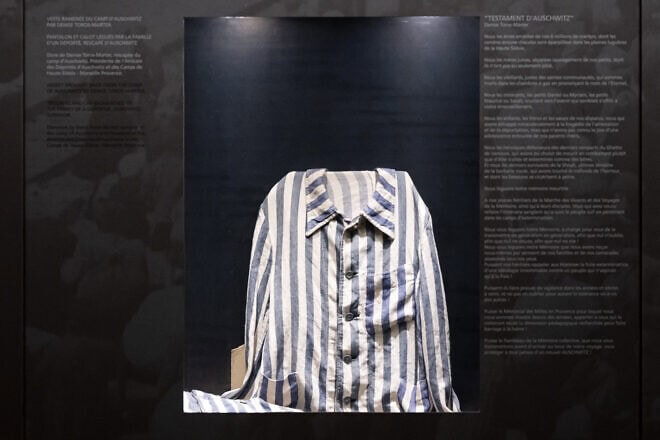A uniform from the Auschwitz concentration camp displayed at the Camp des Milles, an internment and deportation center during World War II, during a visit by members of South Winners, the largest supporters' group of Olympique de Marseille football club, to raise awareness about antisemitism, Aix-en-Provence in southeastern France, on Dec. 23, 2024. Photo by Miguel Medina/AFP via Getty Images.