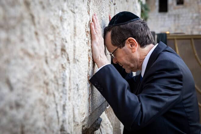 Israel's President Isaac Herzog pray for the safe release of Israelis who have been held hostage in the Gaza Strip since Oct. 7, 2023, by Hamas and other Palestinian terrorists, at the Western Wall in Jerusalem's Old City on Jan. 19, 2025. Photo by Noam Revkin Fenton/Flash90.