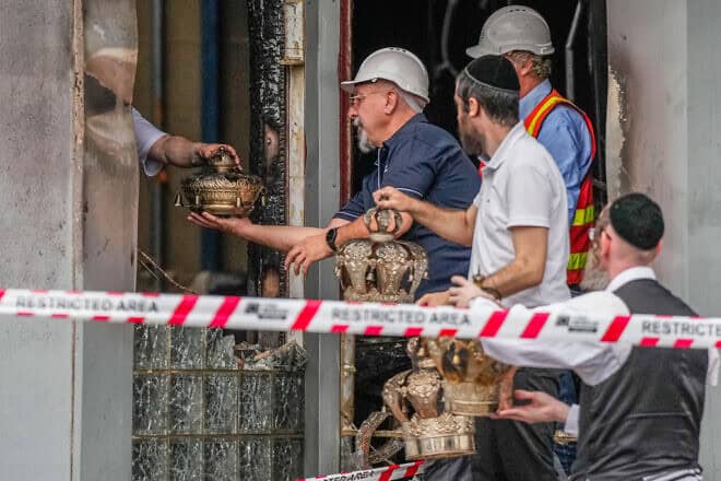 Members of the Adass Israel Synagogue in Melbourne recover items after an arson attack, Dec. 06, 2024. Photo by Asanka Ratnayake/Getty Images.