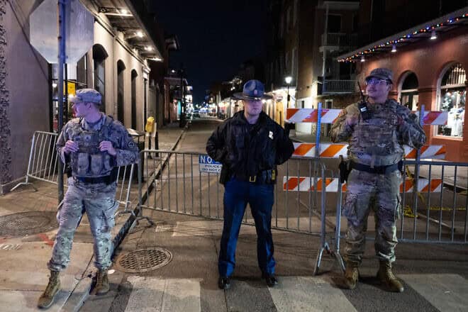 National Guardsmen and a police officer at a blocked off street, a block from Bourbon Street in New Orleans after an ISIS supporter killed 14 people and wounded at least 35 others early on Jan. 1, 2025. Photo by Andrew Caballero-Reynolds/AFP via Getty Images.