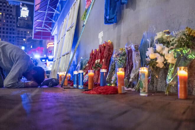 A man reacts to a memorial on Bourbon Street in New Orleans for the people killed in a car-ramming attack on New Year's Day after it reopened to the public, on Jan. 2, 2025. Photo by Andrew Caballero-Reynolds/AFP via Getty Images.