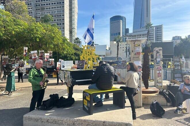 Supporters playing music at "Hostages Square" near the Tel Aviv Museum of Art, on Jan. 19, 2025. Photo by Amelie Botbol.