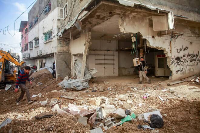 Palestinians examine the aftermath of an Israeli military raid in Tulkarem in Samaria, on Dec. 26, 2024. Photo by Nasser Ishtayeh/Flash90.