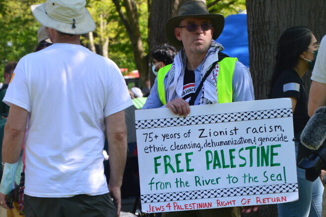 A Jewish man stands alongside a Palestinian encampment during protests against Israel at Rutgers University in New Brunswick, N.J., May 2024. Photo by Faygie Holt.