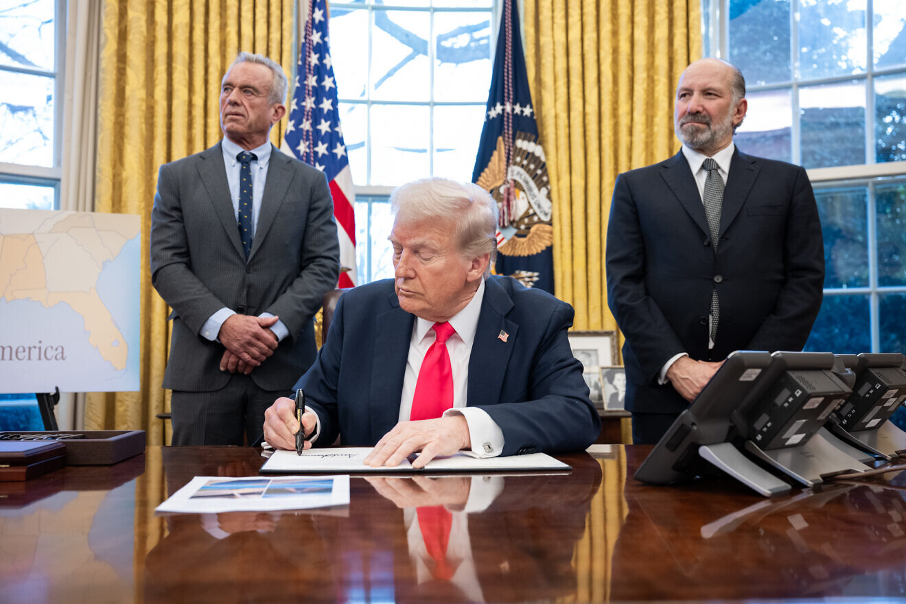 U.S. President Donald Trump signs executive orders in the Oval Office, Feb. 25, 2025. Credit: Molly Riley/White House.