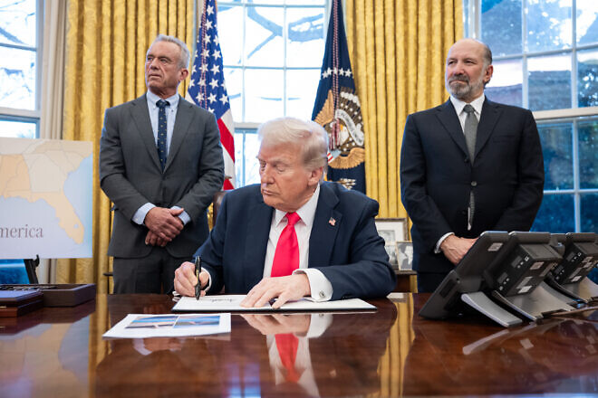U.S. President Donald Trump signs executive orders in the Oval Office, Feb. 25, 2025. Credit: Molly Riley/White House.