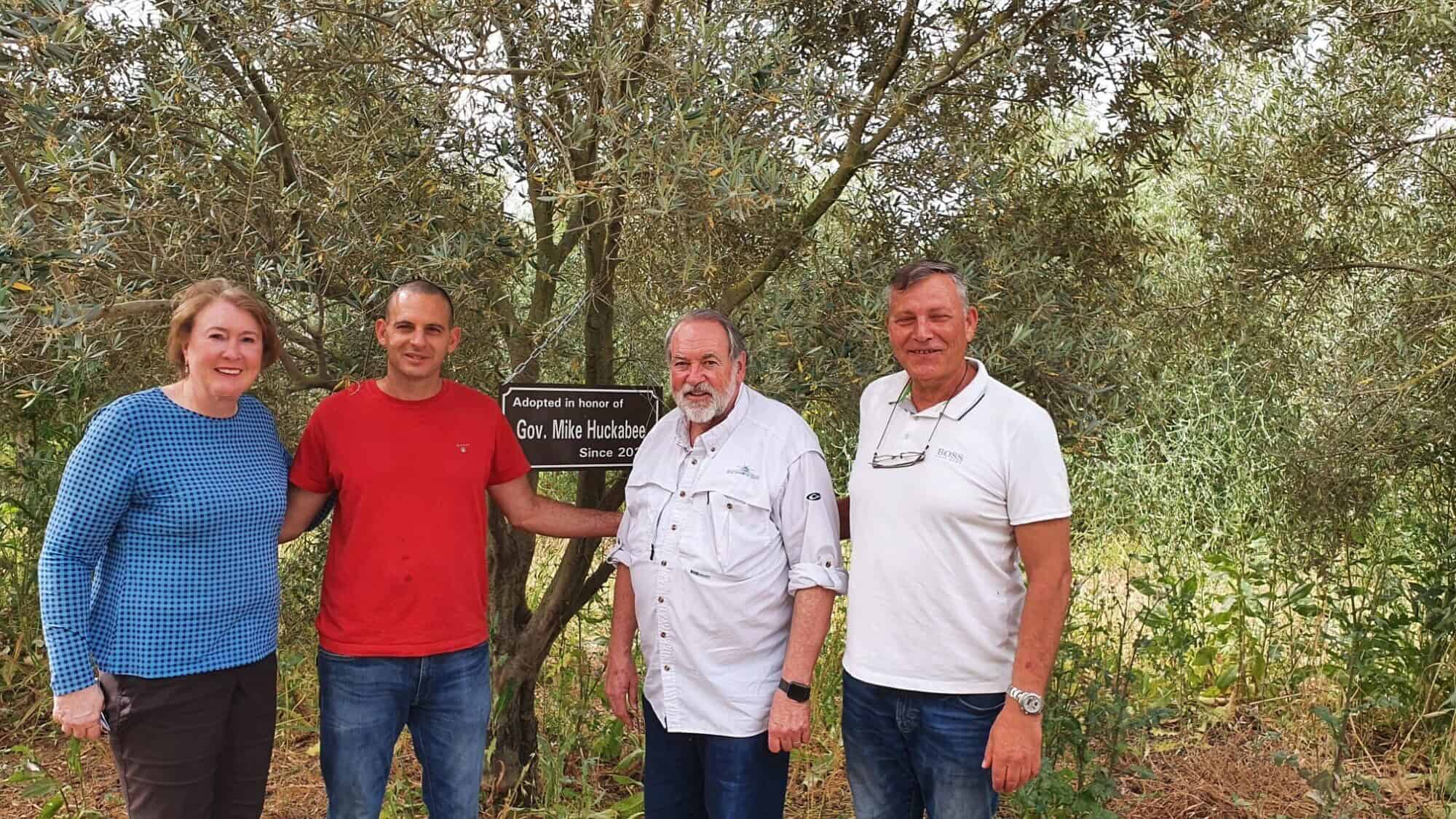 Former Arkansas Gov. Mike Huckabee (third from left) and his wife Janet with olive-grove farmer Gal Ashush (second from left) and My Tree in Israel founder Kobi Assaf in 2022. Credit: Courtesy/My Tree in Israel Archive Photo.