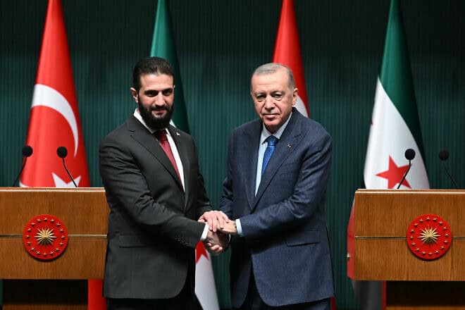 Turkish President Recep Tayyip Erdoğan (right) and Syria's interim president Ahmed al-Sharaa at a joint press conference following their meeting at the Presidential Palace in Ankara on Feb. 4, 2025. Photo by Ozan Kose/AFP via Getty Images.