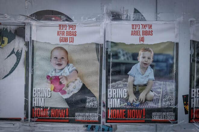 Posters of the Bibas boys, Kfir and Ariel, hang on a wall outside the Knesset in Jerusalem, Feb. 19, 2024. Photo by Chaim Goldberg/Flash90.