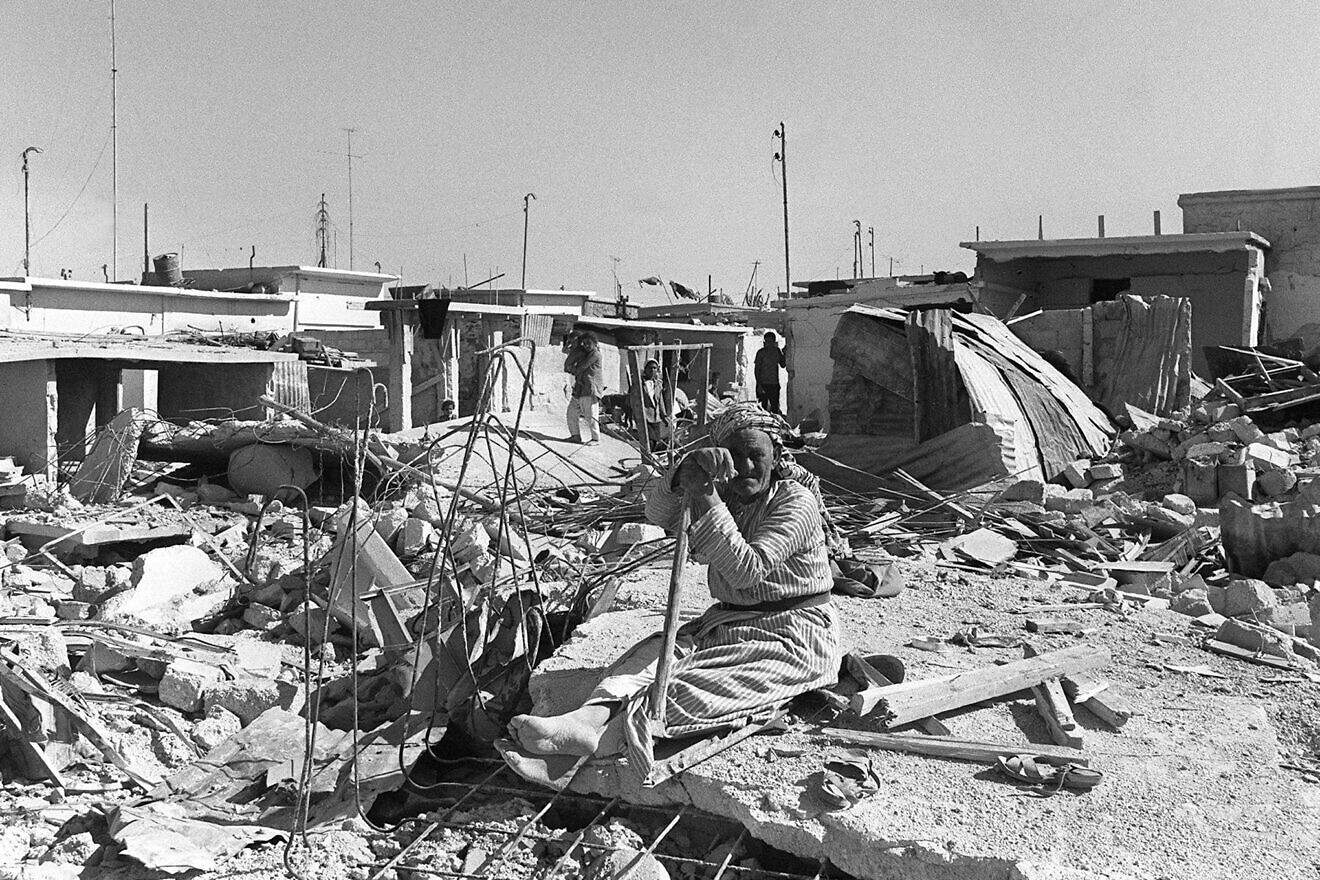 An elder Palestinian man sits on the ruins of his house at the Palestinian camp of Wahadat on Oct. 6, 1970, which was bombed by the Jordanian army during Black September events. In September 1970, King Hussein of Jordan decided to put an end to the Palestinian Liberation Organization's state-within-a-state in Jordan, as well as its guerilla attacks on Israeli-occupied Arab territory in the West Bank, and ordered the Jordanian military to launch attacks to push the PLO out of Jordan. Armed conflict lasted until July 1971. It caused the deaths of thousands of Palestinians and the expulsion of the PLO, and thousands of Palestinian fighters, to Lebanon. Credit: AFP Photo via Getty Images.