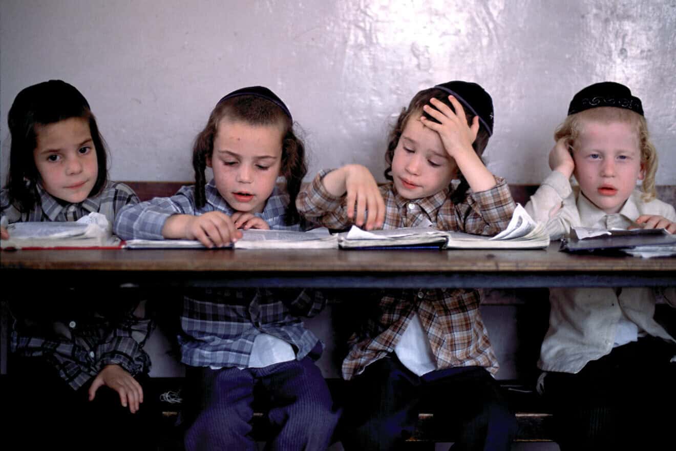 Orthodox Jewish boys study the Torah at a religious school in Jerusalem. Photo by Tom Stoddart/Getty Images.