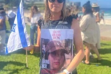 Dionne Taylor holding former hostage Liri Albag's poster. Credit: Courtesy.