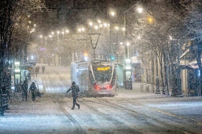 Snow falls on Jaffa Street in downtown Jerusalem as a heavy storm hits nationwide, Jan. 26, 2022. Photo by Yonatan Sindel/Flash90.