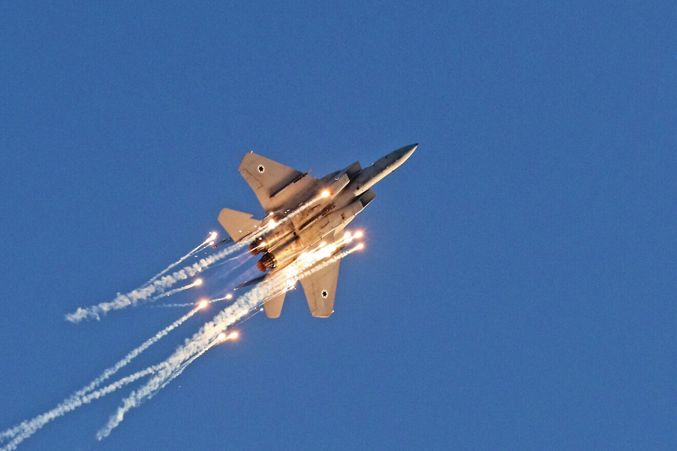 An F-15 Baz during an airshow with flares performs at the Hatzerim Air Force Base, June 24, 2021. Credit: Ofer Zidon/Flash90.