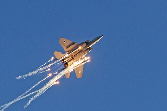 An F-15 Baz during an airshow with flares performs at the Hatzerim Air Force Base, June 24, 2021. Credit: Ofer Zidon/Flash90.