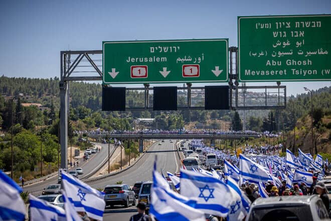 Anti-reform activists marching to Jerusalem on road number 1 near Abu Ghosh, as part of the protests against the government's judicial reform, on July 22, 2023. Photo by Yonatan Sindel/Flash90.
