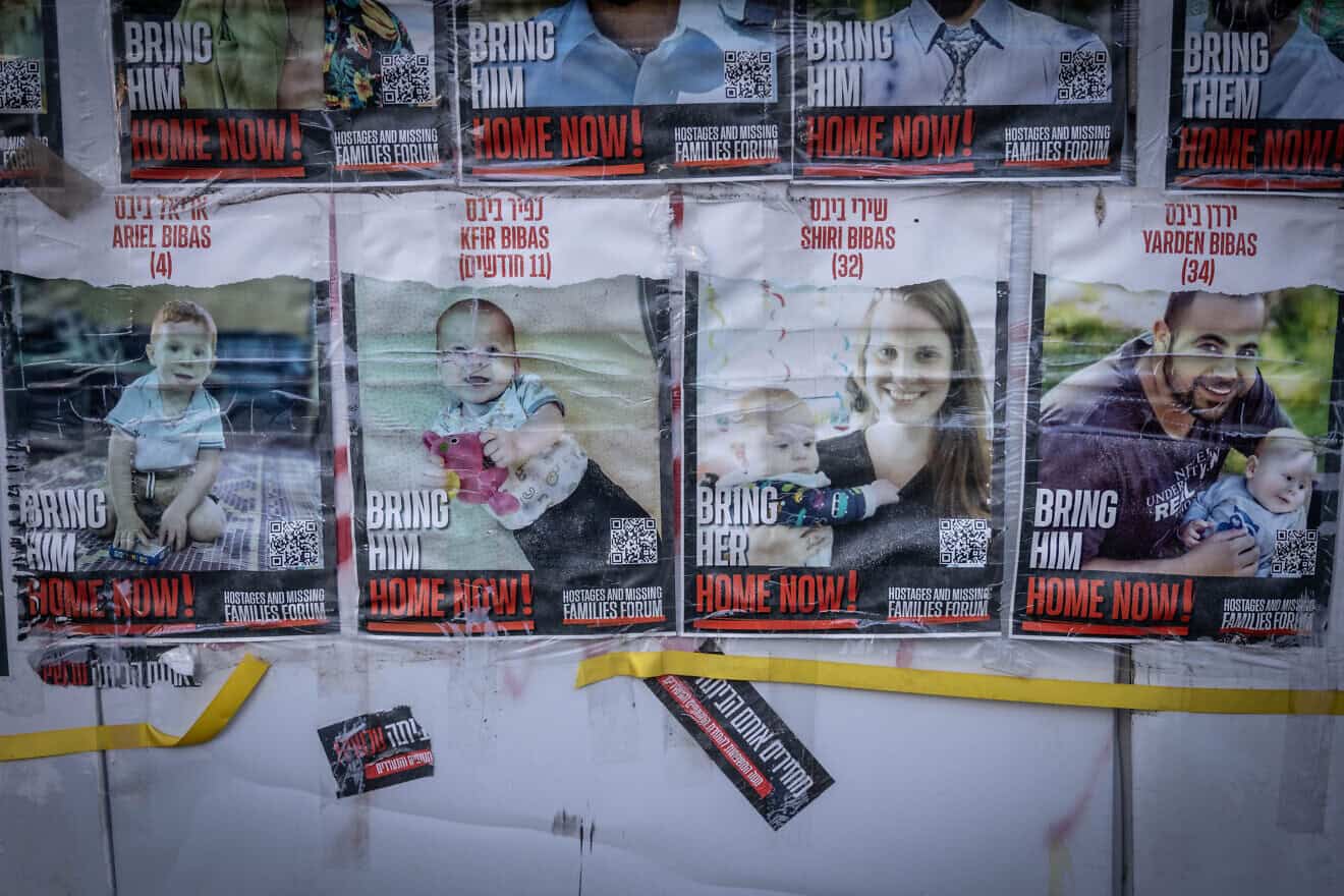 Pictures of the Bibas family hang on a wall outside the Knesset, the Israeli parliament in Jerusalem, Feb. 19, 2024. Photo by Chaim Goldberg/Flash90.