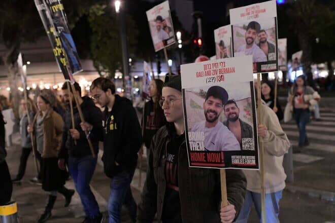 Family, friends and activists hold posters of Israeli brothers Gili and Ziv Berman, who are being held hostage by Hamas terrorists in Gaza, during a protest march for their release in Tel Aviv, Jan. 9, 2025. Photo by Tomer Neuberg/Flash90.