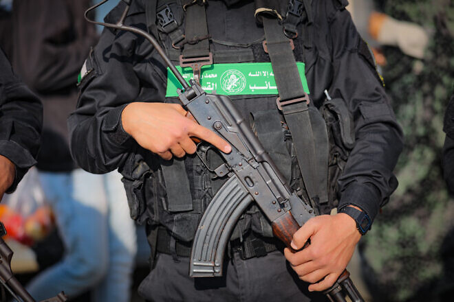 A Hamas terrorist at the funeral of Hamas council member Ghazi Abu Tamaa, in Al-Hajj Musa Mosque in Khan Yunis in Gaza, Feb. 4, 2025. Photo by Ali Hassan/Flash90.