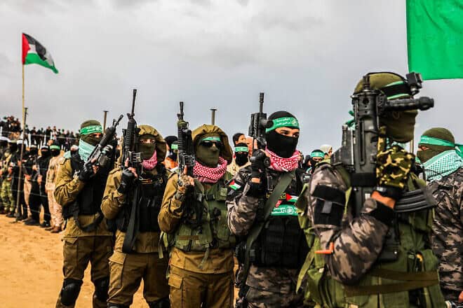 Hamas terrorists release the bodies of four Israeli hostages to the Red Cross in Khan Yunis, Feb. 20, 2025. Photo by Abed Rahim Khatib/Flash90.