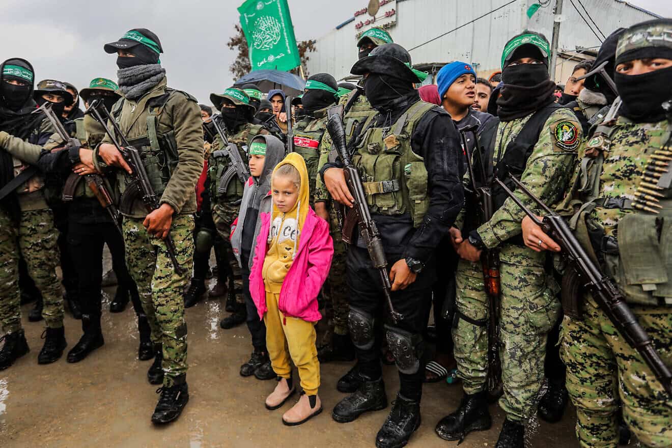 Members of the Al-Qassam Brigades hand over of Israeli hostages to the Red Cross, as part of the ceasefire agreement between Israel and Hamas, in Rafah, Feb. 22, 2025. Photo by Abed Rahim Khatib/Flash90.