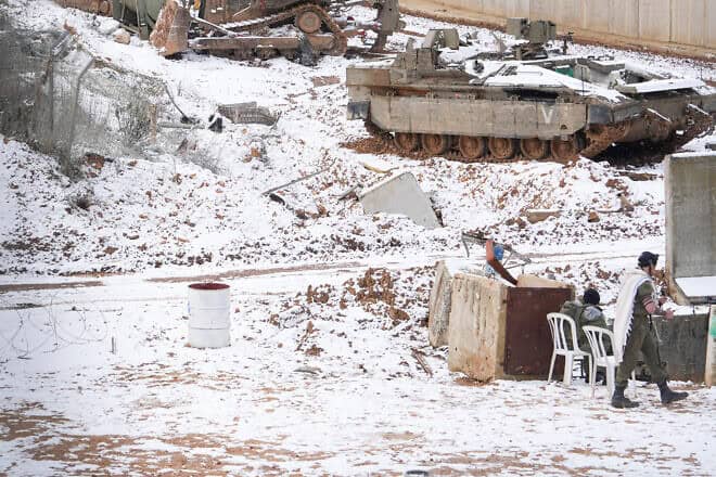 Israeli soldiers seen in the snow on the Israeli border with Lebanon, on Feb. 24, 2025. Photo by Ayal Margolin/Flash90.